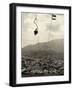 Man Riding Chair Lift Above Town-Jerry Cooke-Framed Photographic Print