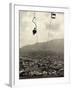 Man Riding Chair Lift Above Town-Jerry Cooke-Framed Photographic Print