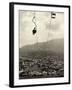 Man Riding Chair Lift Above Town-Jerry Cooke-Framed Photographic Print