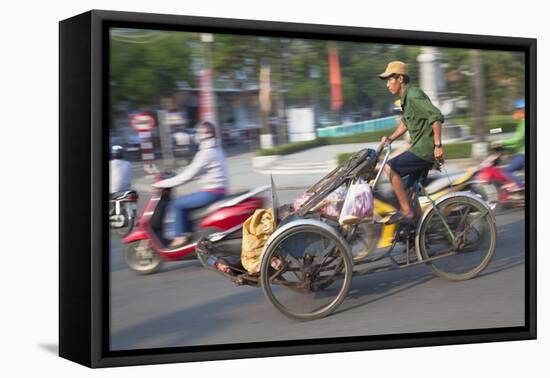 Man Riding Cyclo, Hue, Thua Thien-Hue, Vietnam, Indochina, Southeast Asia, Asia-Ian Trower-Framed Stretched Canvas