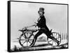 Man Riding Early Bicycle-null-Framed Stretched Canvas