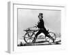 Man Riding Early Bicycle-null-Framed Giclee Print