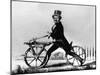 Man Riding Early Bicycle-null-Mounted Giclee Print