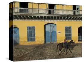 Man Riding Horse Past the Galeria Del Arte (Art Gallery), Plaza Mayor, Trinidad, Cuba-Eitan Simanor-Stretched Canvas