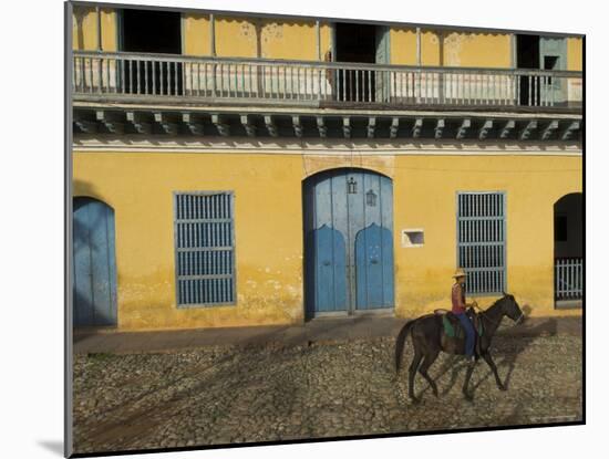 Man Riding Horse Past the Galeria Del Arte (Art Gallery), Plaza Mayor, Trinidad, Cuba-Eitan Simanor-Mounted Photographic Print