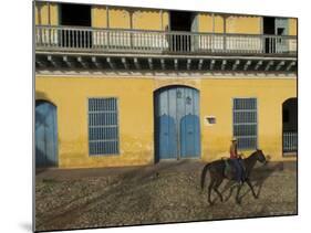 Man Riding Horse Past the Galeria Del Arte (Art Gallery), Plaza Mayor, Trinidad, Cuba-Eitan Simanor-Mounted Photographic Print