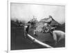 Man Riding Zebra Jumping Fence Photograph - Africa-Lantern Press-Framed Premium Giclee Print