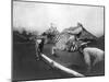 Man Riding Zebra Jumping Fence Photograph - Africa-Lantern Press-Mounted Art Print