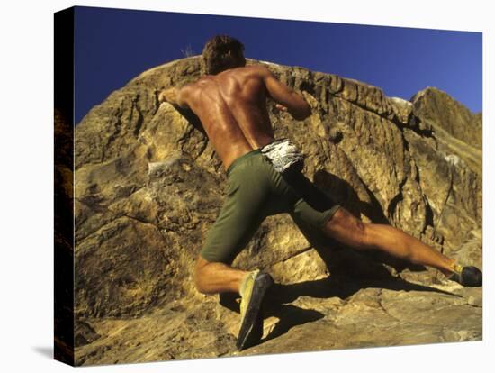 Man Rock Climbing Without Equipment-null-Stretched Canvas
