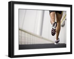 Man Running across a Bridge, United Arab Emirates-Julian Love-Framed Photographic Print