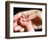 Man's Hand Holding Baby's Hand-Mitch Diamond-Framed Photographic Print