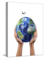 Man's Hands Holding the Planet Earth, with a Jet Aircraft Flying Above-null-Stretched Canvas