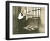 Man Sawing Through Bars-null-Framed Photo