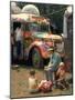 Man Seated with Two Young Boys in Front of a Wildly Painted School Bus, Woodstock Music Art Fest-John Dominis-Mounted Photographic Print