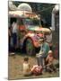 Man Seated with Two Young Boys in Front of a Wildly Painted School Bus, Woodstock Music Art Fest-John Dominis-Mounted Photographic Print