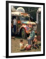 Man Seated with Two Young Boys in Front of a Wildly Painted School Bus, Woodstock Music Art Fest-John Dominis-Framed Photographic Print