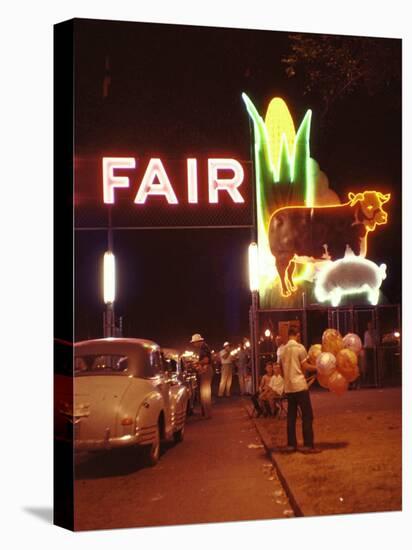 Man Selling Balloons at Entrance of Iowa State Fair-John Dominis-Stretched Canvas