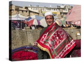 Man Selling Rugs on Banks of Kabul River, Central Kabul, Afghanistan-Jane Sweeney-Stretched Canvas