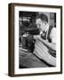 Man Sewing Strips of Fur Together-Dmitri Kessel-Framed Photographic Print