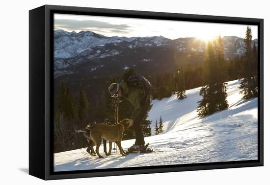 Man Shows His Dogs Affection Before A Morning Backcountry Ski In Montana's Gallatin Range-Hannah Dewey-Framed Stretched Canvas