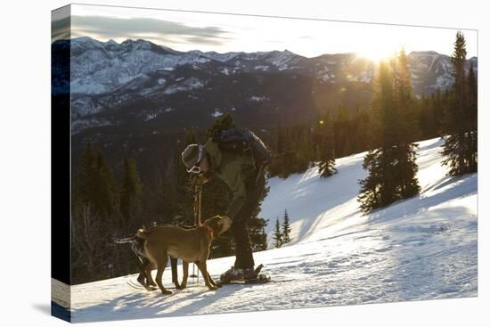 Man Shows His Dogs Affection Before A Morning Backcountry Ski In Montana's Gallatin Range-Hannah Dewey-Stretched Canvas