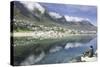 Man Sits on Rock Facing Twelve Apostles Mountain Reflected in Atlantic Ocean, Camp's Bay, Cape Town-Kimberly Walker-Stretched Canvas