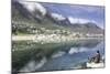 Man Sits on Rock Facing Twelve Apostles Mountain Reflected in Atlantic Ocean, Camp's Bay, Cape Town-Kimberly Walker-Mounted Photographic Print