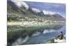 Man Sits on Rock Facing Twelve Apostles Mountain Reflected in Atlantic Ocean, Camp's Bay, Cape Town-Kimberly Walker-Mounted Photographic Print