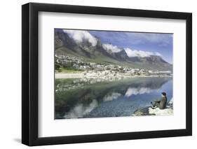 Man Sits on Rock Facing Twelve Apostles Mountain Reflected in Atlantic Ocean, Camp's Bay, Cape Town-Kimberly Walker-Framed Photographic Print