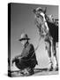 Man Sitting Holding His Horses Reins-Loomis Dean-Stretched Canvas