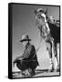 Man Sitting Holding His Horses Reins-Loomis Dean-Framed Stretched Canvas