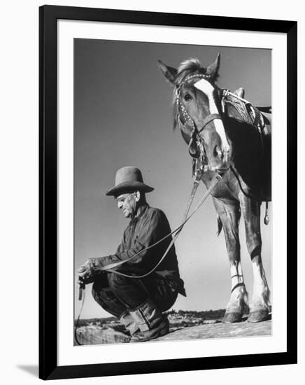 Man Sitting Holding His Horses Reins-Loomis Dean-Framed Photographic Print