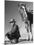 Man Sitting Holding His Horses Reins-Loomis Dean-Mounted Photographic Print