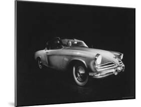 Man Sitting in the 1953 Starliner Studebaker Which is Capable Of Taking Sharp Curves at High Speed-Howard Sochurek-Mounted Photographic Print