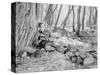 Man Sitting Next to a Fire in the Woods and Reading a Book-null-Stretched Canvas