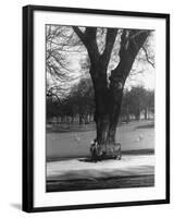 Man Sitting on a Bench and Reading a Newspaper in the Park-Cornell Capa-Framed Photographic Print