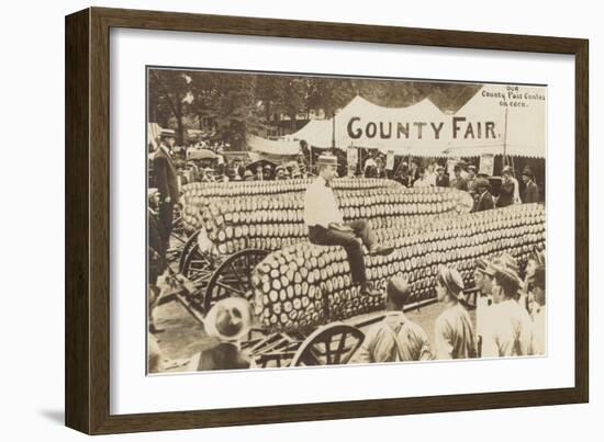 Man Sitting on Giant Ear of Corn-null-Framed Art Print