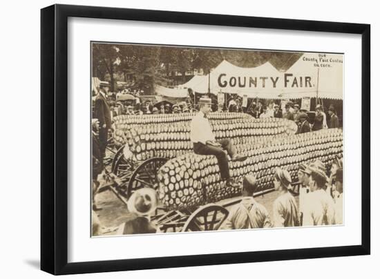 Man Sitting on Giant Ear of Corn-null-Framed Art Print