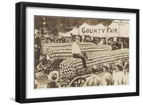 Man Sitting on Giant Ear of Corn-null-Framed Art Print