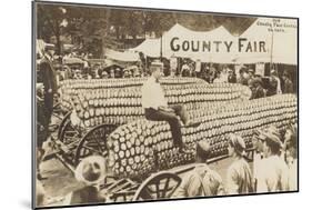 Man Sitting on Giant Ear of Corn-null-Mounted Art Print