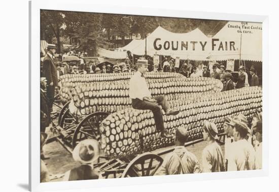 Man Sitting on Giant Ear of Corn-null-Framed Art Print