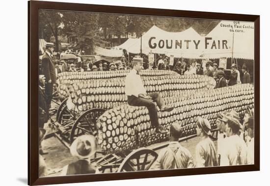 Man Sitting on Giant Ear of Corn-null-Framed Art Print