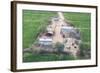 Man Sitting on House Roof in Tiny Agricultural Hamlet Amidst Fields of Vegetables, Rajasthan, India-Annie Owen-Framed Photographic Print