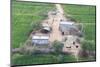 Man Sitting on House Roof in Tiny Agricultural Hamlet Amidst Fields of Vegetables, Rajasthan, India-Annie Owen-Mounted Photographic Print