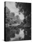 Man Sitting on the Bank of the Upper Opalescent River, a Branch of the Hudson-Margaret Bourke-White-Stretched Canvas