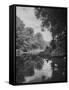 Man Sitting on the Bank of the Upper Opalescent River, a Branch of the Hudson-Margaret Bourke-White-Framed Stretched Canvas