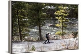 Man Skins On A Snowy Forest Service Road Next To The Gallatin River Near Big Sky, Montana-Hannah Dewey-Framed Photographic Print