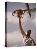 Man Slam-Dunking a Basketball-null-Stretched Canvas