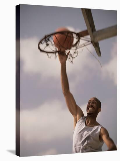 Man Slam-Dunking a Basketball-null-Stretched Canvas