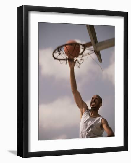 Man Slam-Dunking a Basketball-null-Framed Photographic Print